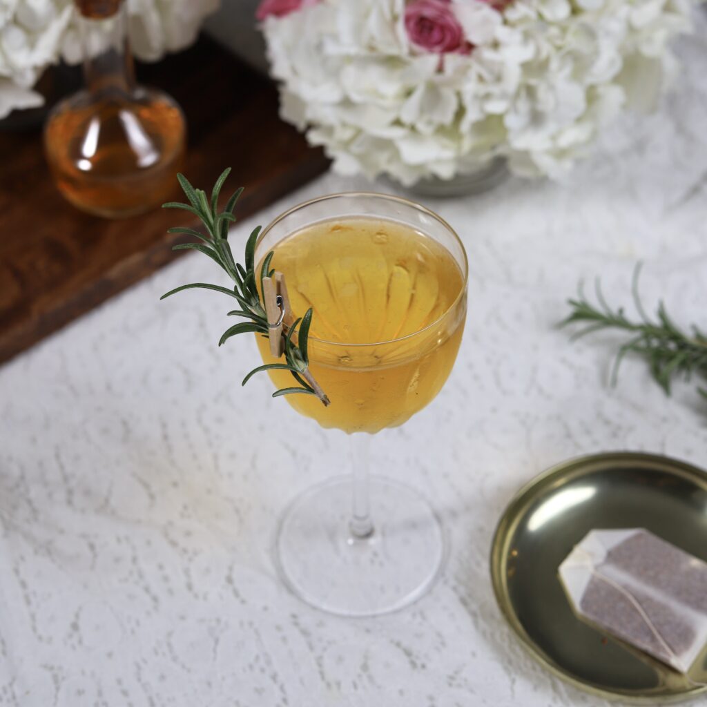 Sparkling wine tea apricot rosemary cocktail