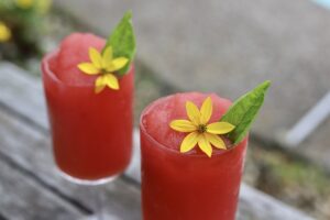 Watermelon Frose with flower and basil garnish